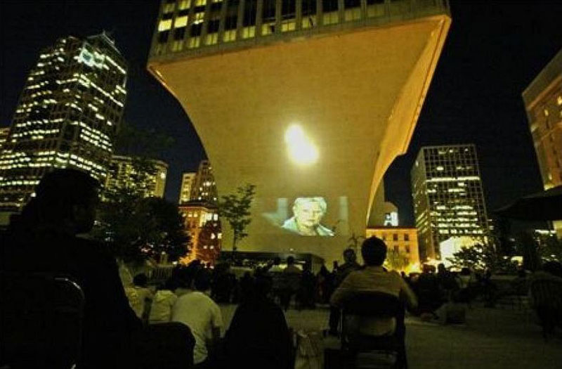 Casino Royale is projected onto the base of the Rainier Tower for Movies